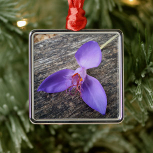 Purple flower on a bench metal ornament
