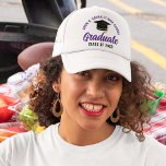 Purple Graduate Custom Class of 2025 Graduation Trucker Hat<br><div class="desc">These modern purple custom senior graduate hats feature your high school or college name for the class of 2025. Customise with your graduating year under the chic handwritten script and black grad cap for a great personalised graduation party favour gift.</div>