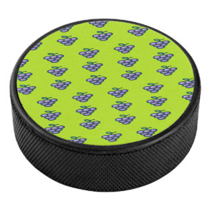 Purple grapes pattern on green hockey puck