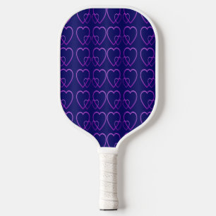 Purple hearts on blue pickleball paddle