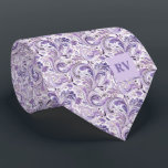 Purple Lilac Floral Paisley Tie<br><div class="desc">Introducing the 'Purple Floral Paisley Necktie' – a trailblazing masterpiece in the realm of wedding fashion. This distinctive necktie caters to fashion-forward brides in search of groomsmen accessories that seamlessly fuse vintage allure with a contemporary edge. Central to its allure is the captivating fusion of vintage-inspired elements and a daring...</div>