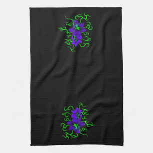 purple lily flower on black tea towel