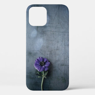 Purple petaled flower on grey surface iPhone 12 case