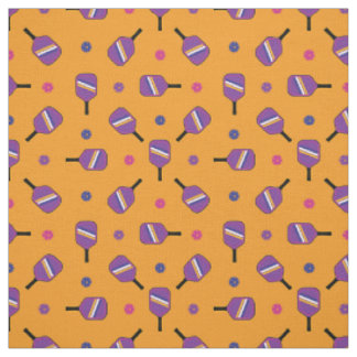 Purple Pickleball paddles on orange Fabric