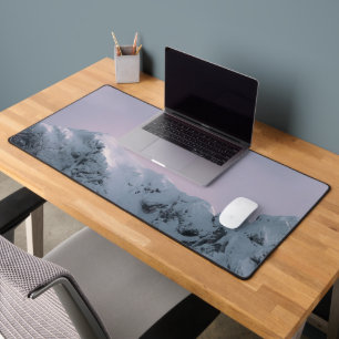 Purple sky over mountains desk mat