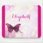 Purple Watercolor Butterfly on Pink and Yellow Mouse Pad<br><div class="desc">A beautiful purple butterfly painted with watercolors. Set upon a delicate background which has a soft and misty watercolor texture with romantic pink and yellow faded flowers. With an antique logo faintly visible at the bottom to give it some vintage flair. Customise with a name in a fancy handwritten font....</div>