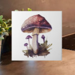 Purple Watercolor Woodland Mushroom Cottagecore Ceramic Tile<br><div class="desc">Add the charm and whimsy of the popular Cottagecore aesthetic to your home with this beautiful watercolor woodland mushroom ceramic tile. In tones of purple, brown and green, the motif will add a cosy feel to your kitchen backsplash or counter, bathroom, fireplace or other tiled space. Also makes a great...</div>