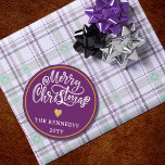Purple White Gold Merry Christmas Classic Round Sticker<br><div class="desc">Make this holiday season extra special with our Purple White Gold Merry Christmas stickers. Whether you're embellishing your homemade gifts or sprucing up your holiday cards, these stickers are the perfect finishing touch. The sophisticated colour palette of black, white, and gold adds a touch of luxury to your Christmas festivities....</div>