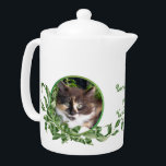 Purrrfect Tea Calico Kitten<br><div class="desc">Cat lovers will delight in this teapot with cute calico kitten snuggled in a jade plant. Her unique green eyes are irresistible. Purrrfect Tea for You and Me text is included. Text may be personalised in template provided. You may also enjoy matching mugs and tea jar as well as the...</div>