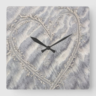 Quirky heart drawing in the sand square square wall clock