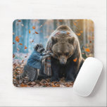 Raccoon Tying a Scarf On a Bear Mouse Pad<br><div class="desc">A raccoon is tying a warm knit scarf around the neck of a grizzly bear in the autumn woods</div>