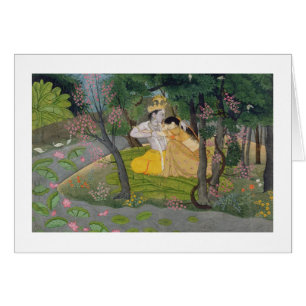 Radha and Krishna embrace in a grove of flowering