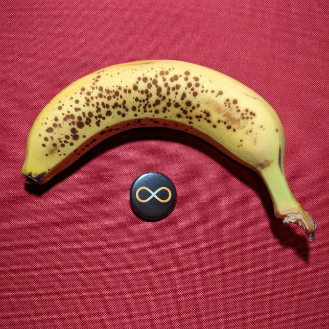 Radiant Gold Autism Awareness Infinity Knot 3 Cm Round Badge (Small button with banana for scale.)
