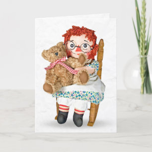 Rag doll and teddy bear in rocking chair card