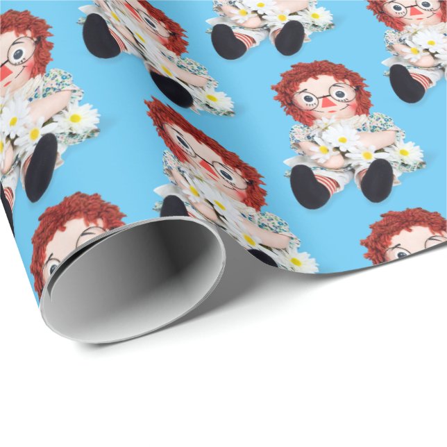 Rag doll with daisies on blue wrapping paper (Roll Corner)