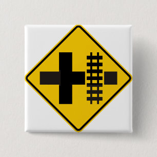 Railroad Parallels Main Road at Crossroad Sign 15 Cm Square Badge