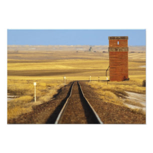 Railroad tracks lead to old granary at Collins Photo Print