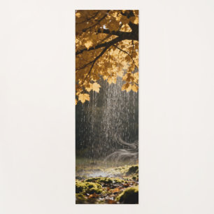 Rain pours from lush branches onto mossy ground yoga mat
