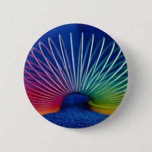 Rainbow-coloured slinky toy 6 cm round badge