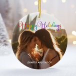 Rainbow Happy Holidays LGBTQ Couple Photo Ceramic Ornament<br><div class="desc">Elegant Happy Holidays photo ornament with beautiful rainbow cursive typography. This modern LGBTQ holiday couple photograph gift features gorgeous script and your name in white over the full bleed picture of an LGBT couple. Personalise this cute keepsake Christmas ornament with your favourite photograph.</div>