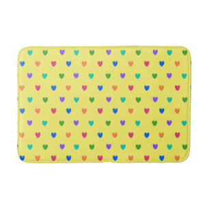 Rainbow polka hearts on yellow bath mat