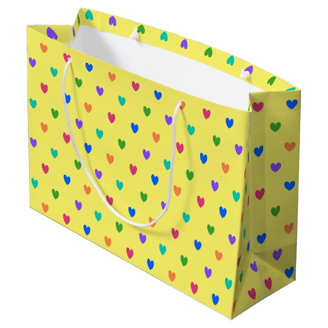 Rainbow polka hearts on yellow large gift bag (Back Angled)