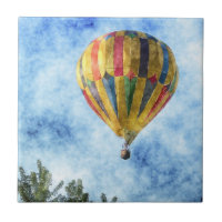 Rainbow Takeoff: Hot Air Balloon in Flight