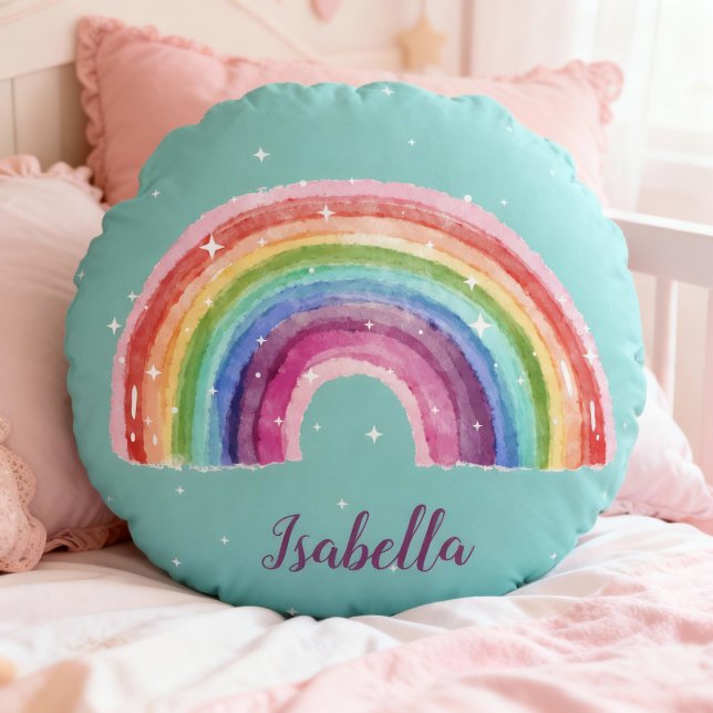 rainbow with asterisk | personalizable round cushion (rundes türkises Kissen mit einem Aquaell-Regenbogen und weißen Sternchen, personalisierbar)