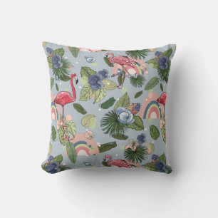 Rainbows and pink flamingos in tropical leaves and cushion