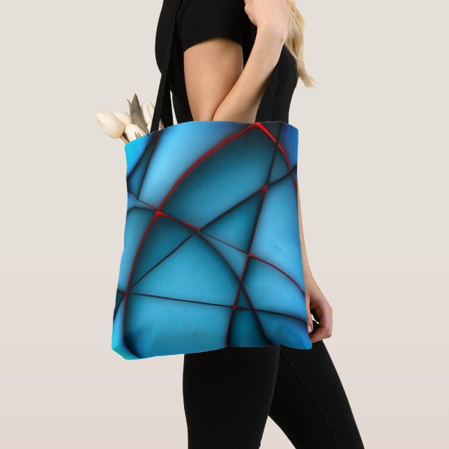 Raised blue shapeless cutouts with red ember cleft tote bag (Close Up)