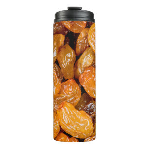 Raisins close up photo texture background. thermal tumbler