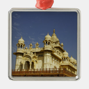 Rajasthan, India A woman standing at and accient Metal Tree Decoration
