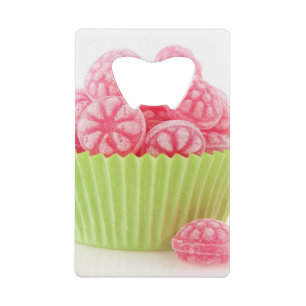 Raspberry tasty candy sweets in green cup cake
