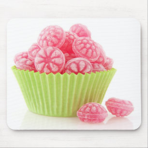 Raspberry tasty candy sweets in green cup cake mouse pad