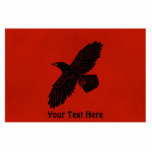 Raven On Red Photo Sculpture Magnet<br><div class="desc">A simple,  black silhouette of a Raven (Corvus corax) on a red background. The raven image has been given a slight "rough" or "worn" effect. Add your own text.</div>