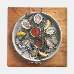 Raw oysters arranged magnet