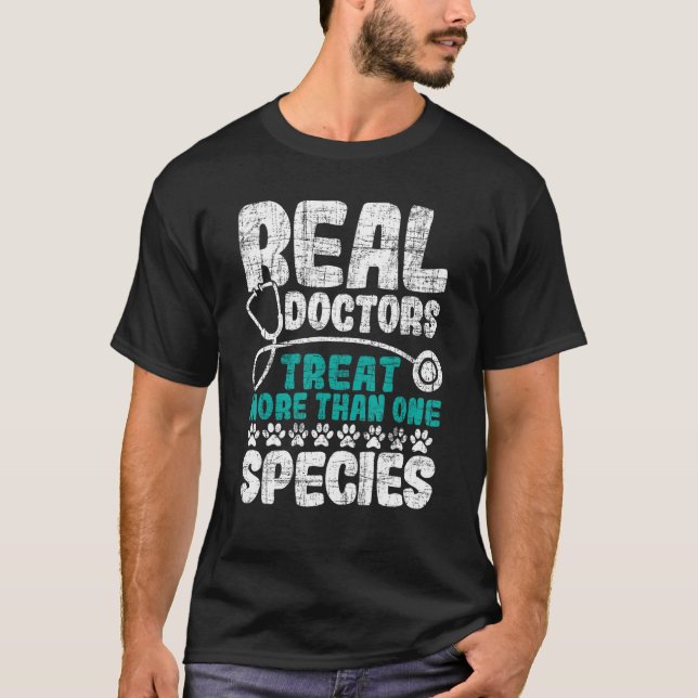 Real Doctors Treat More Than One Species   Veterin T-Shirt (Front)