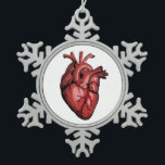 Realistic Anatomical Heart Image Snowflake Pewter Christmas Ornament<br><div class="desc">Are you in the medical profession or know someone who is? Perhaps your cardiologist, intensive care nurse, a medial student, or a cardiac patient? This realistic looking image of a human heart shows what is closest to their… well, heart. It’s a fun take on a serious subject. Perhaps even something...</div>