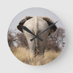 Rear view of elephant round clock