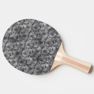 Rectangular forms of grey color and dark spots ping pong paddle