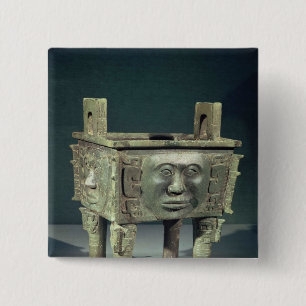 Rectangular 'ting' vessel with human faces 15 cm square badge