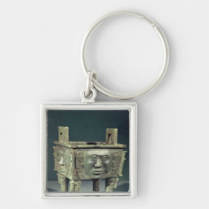 Rectangular 'ting' vessel with human faces key ring