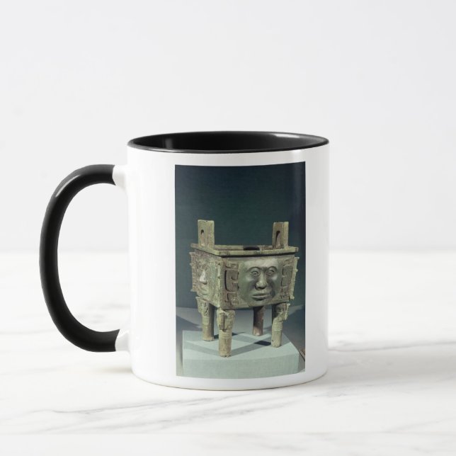 Rectangular 'ting' vessel with human faces mug (Left)