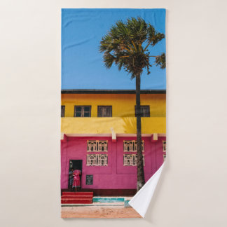 RED AND BROWN CONCRETE BUILDING NEAR TREE UNDER BL BATH TOWEL