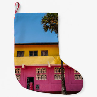 RED AND BROWN CONCRETE BUILDING NEAR TREE UNDER BL SMALL CHRISTMAS STOCKING