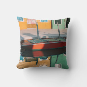 RED AND GREEN BOAT DOCKING ON DOCK CUSHION