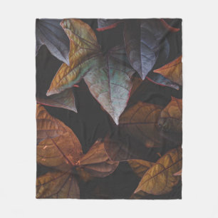 RED AND GREEN LEAVES ON BLACK BACKGROUND FLEECE BLANKET