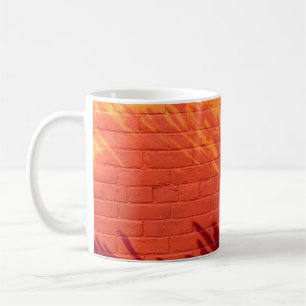 Red and orange painted brick wall coffee mug