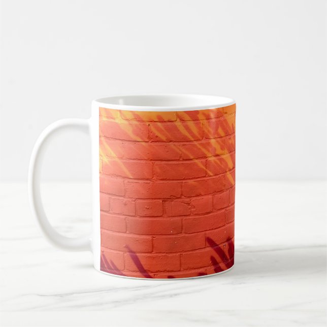 Red and orange painted brick wall coffee mug (Left)