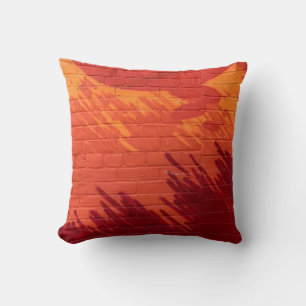 Red and orange painted brick wall cushion